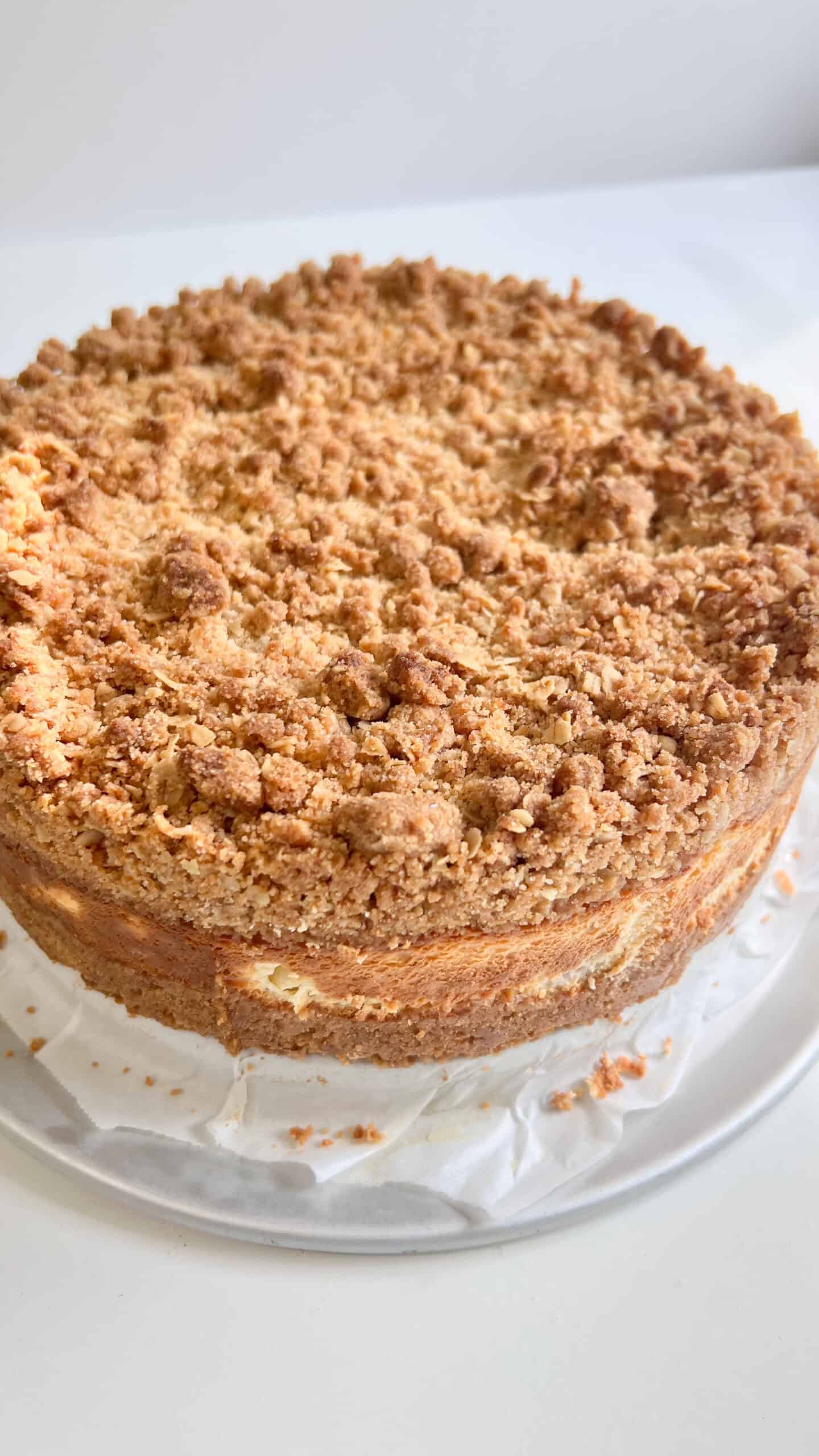 Delicious thick bakery-style lemon cream crumb cheesecake with a crunchy topping.
