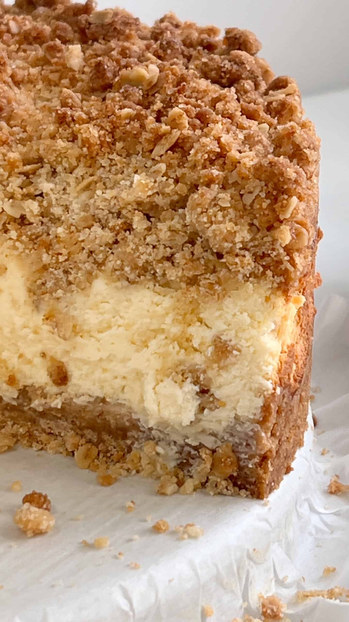 Delicious Lemon Cream Crumb Cheesecake with thick bakery-style crust and creamy lemon filling. Perfe.
