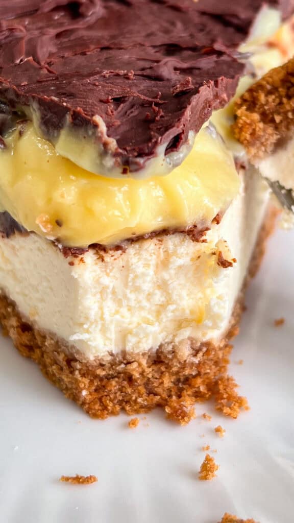 slice of Boston Cream Pie Cheesecake with fork