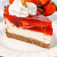 Delicious strawberry cheesecake with creamy filling and fresh strawberries on top.