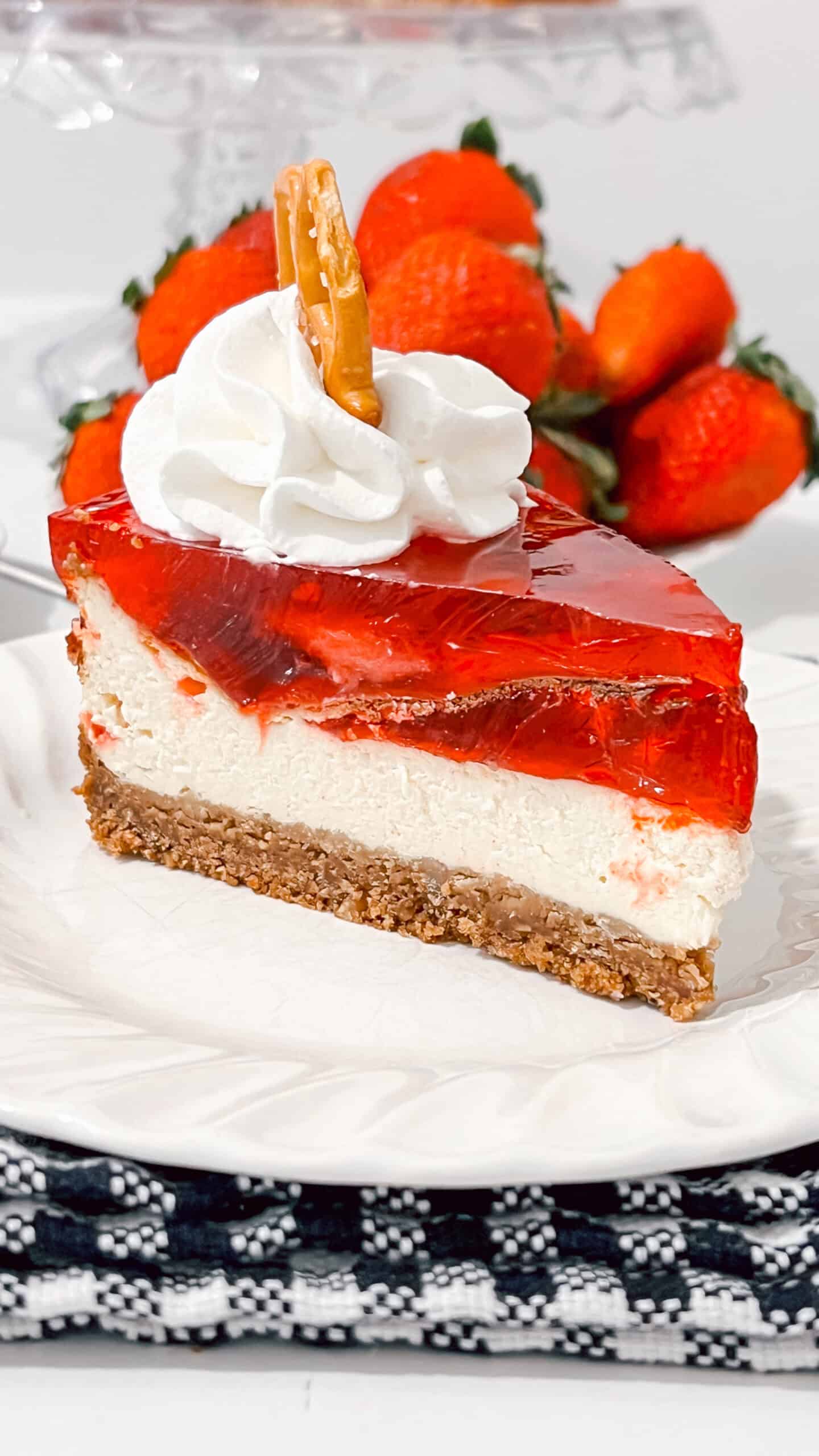 Delicious strawberry cheesecake with creamy filling and fresh strawberries on top.